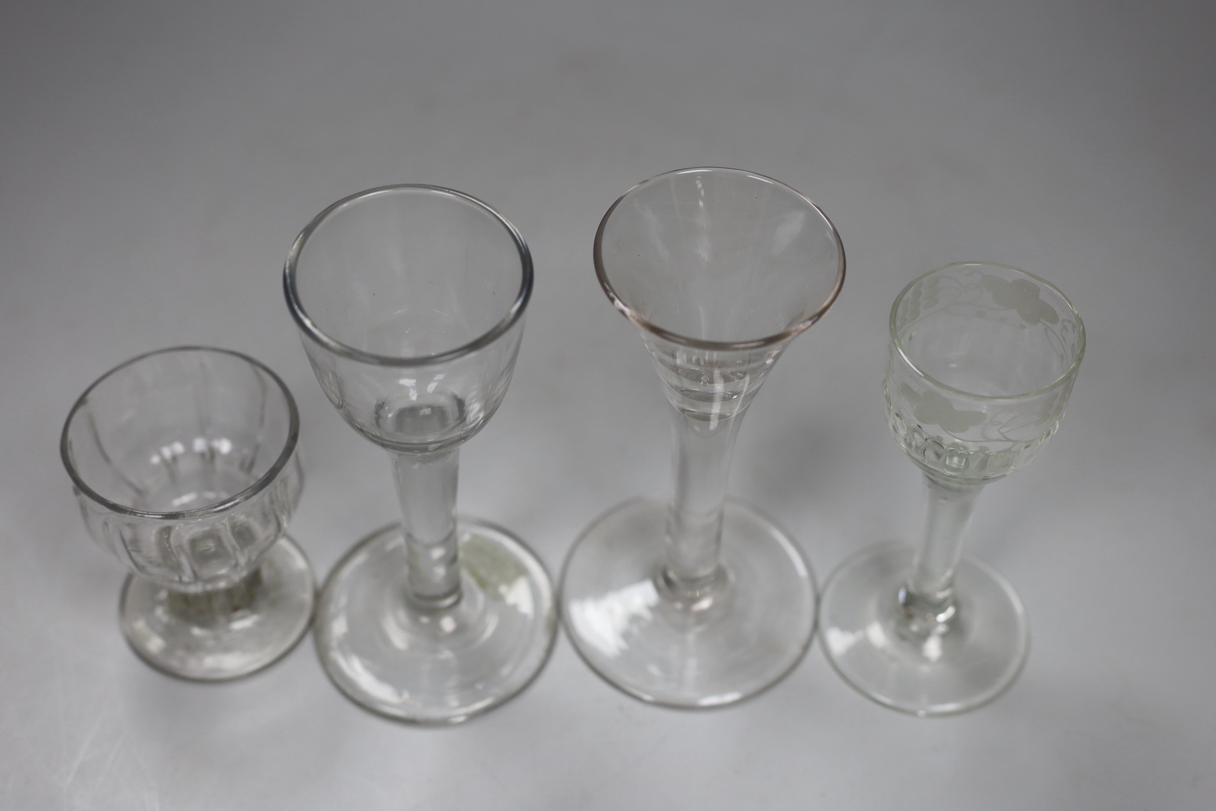 Two George II cordial glasses, a syllabub cup and another cordial glass, tallest 15cm high (4)